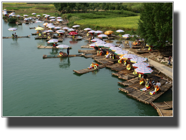 Bamboo rafts waiting for tourists.  DSC03384.jpg